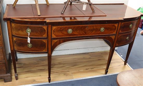 A George III mahogany and satinwood-banded D-shaped breakfront sideboard W.180cm